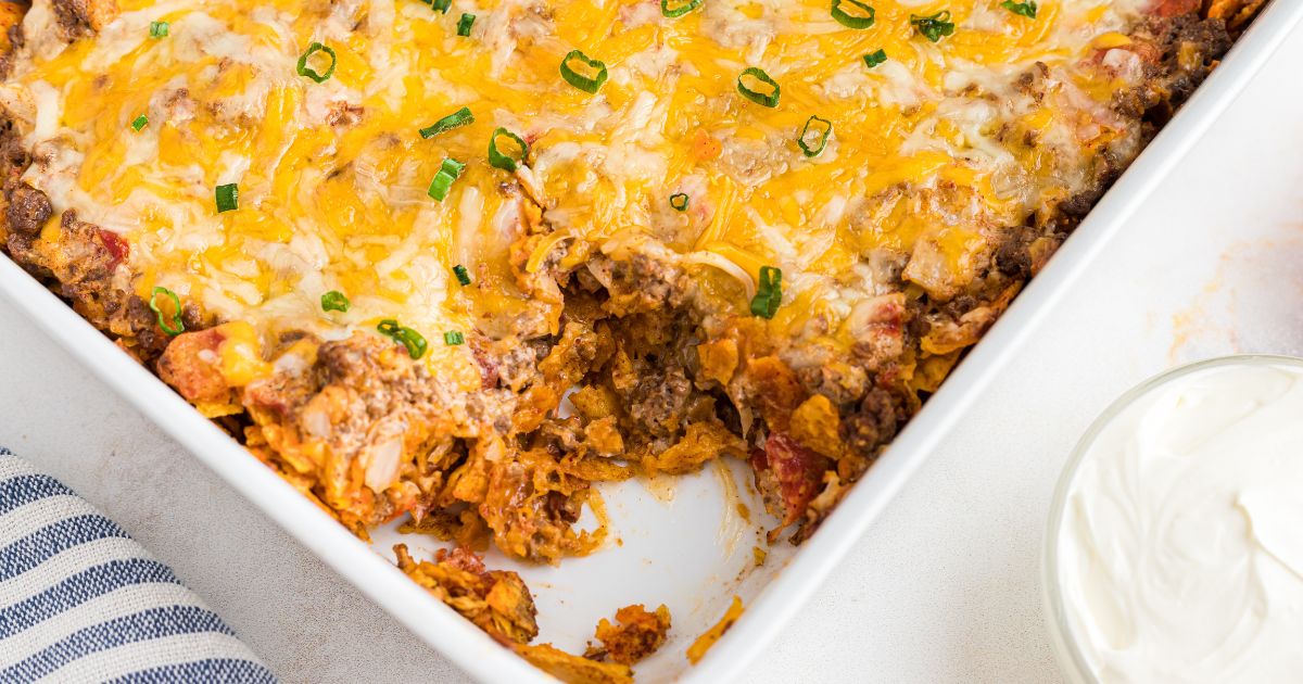 Cheese and meat combined in a white casserole dish.