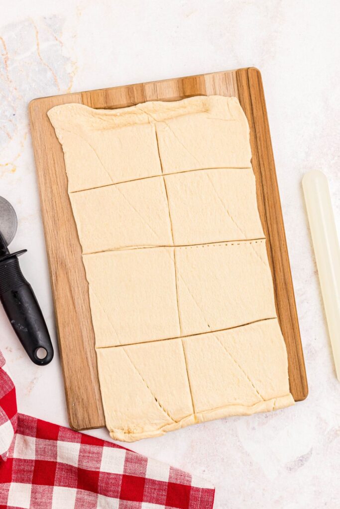 Crescent roll dough rolled out and cut into eight sections. 