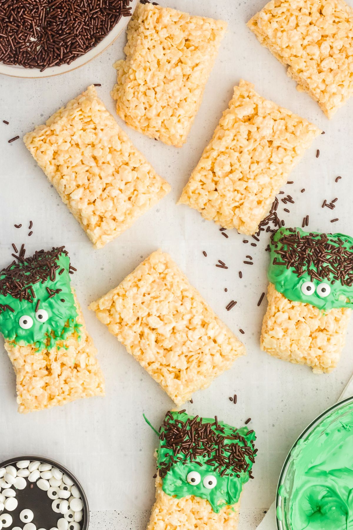 Rice krispie treats dipped into green melting chocolate then topped with sprinkles and candy eyes. 