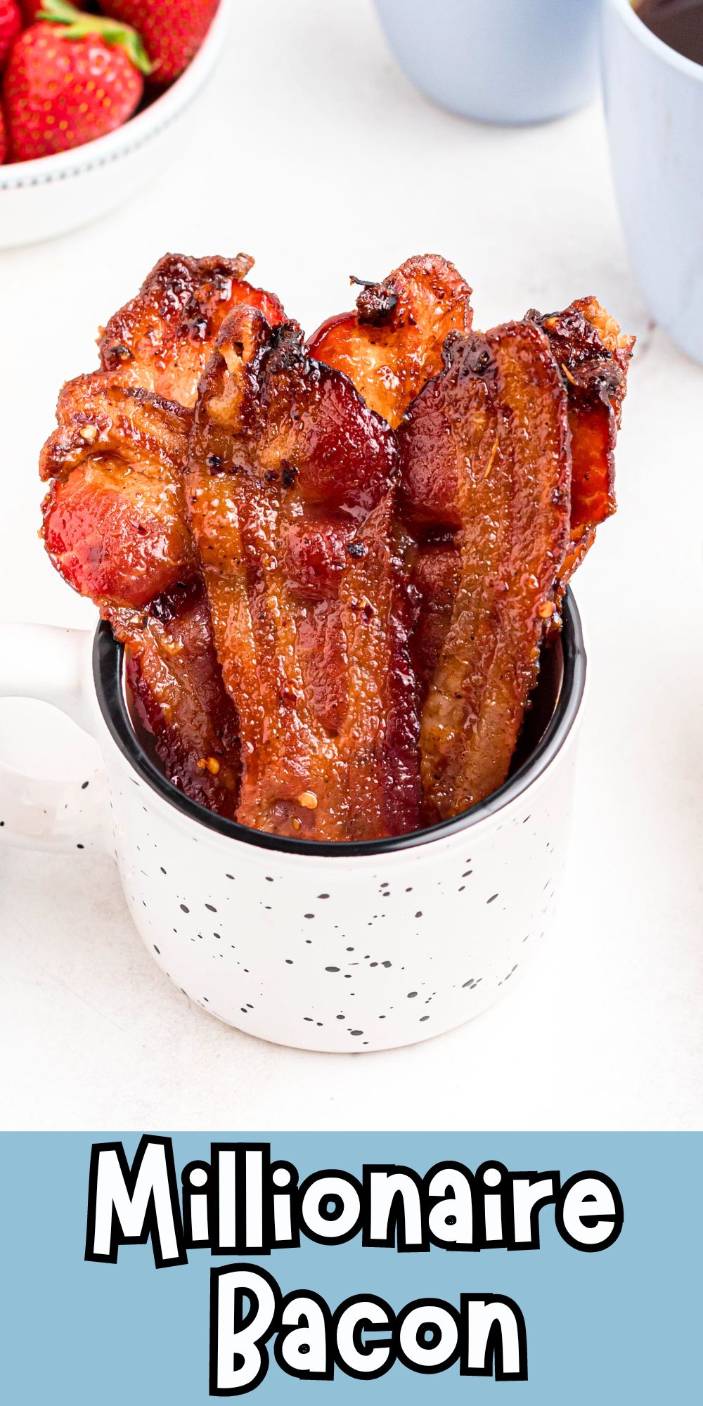 Juicy brown candied bacon in a mug after being cooked in the oven.