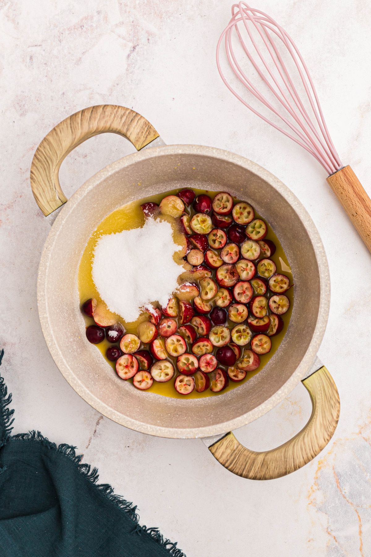 Cranberries with orange juice and sugar in a medium sauce pan. 