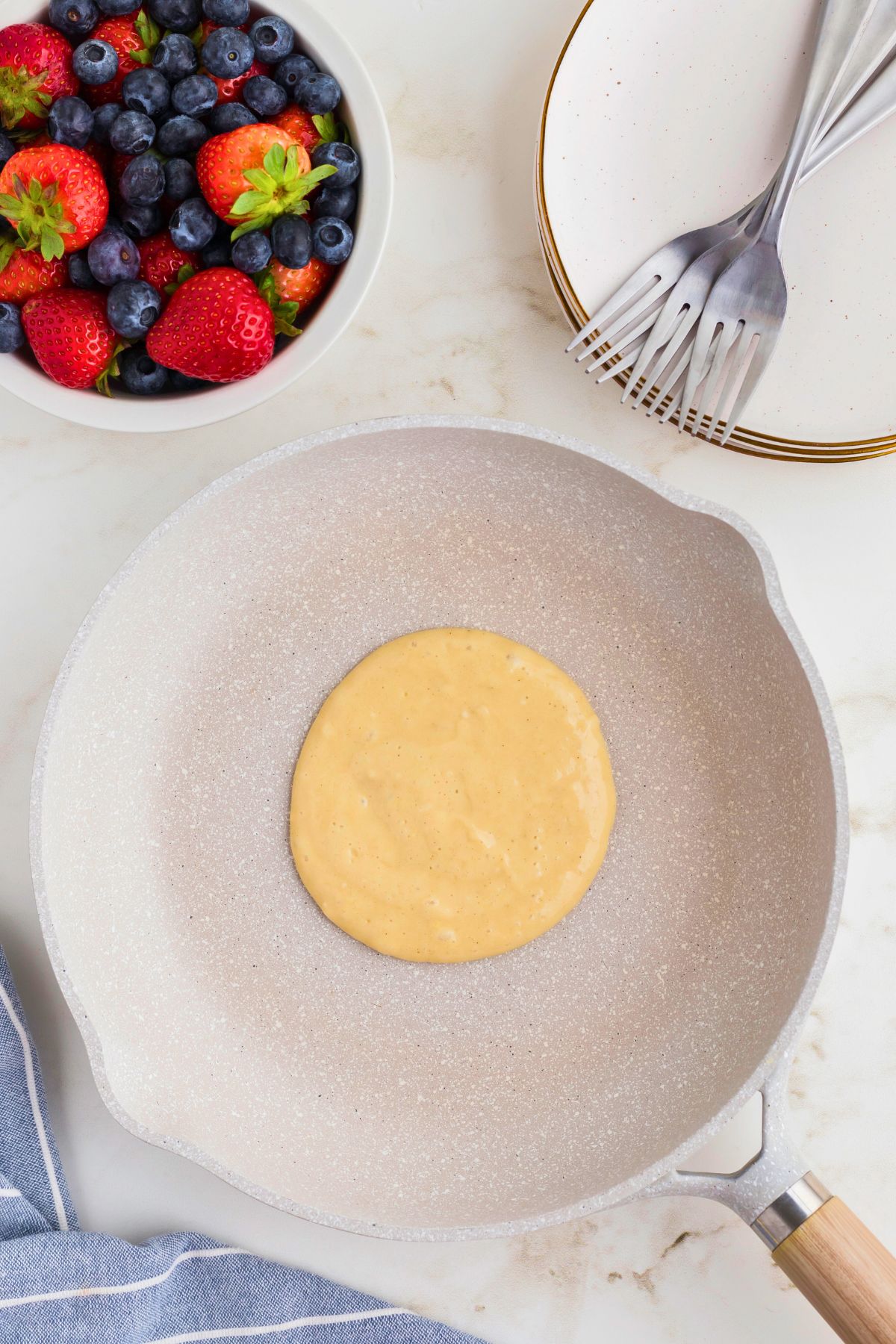 Pancake batter in the skillet as it's cooking.