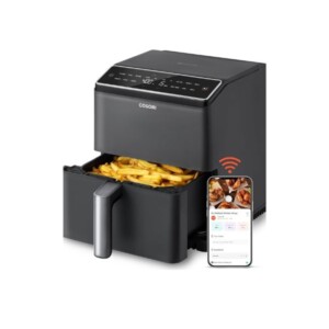 Black air fryer with food in the basket.