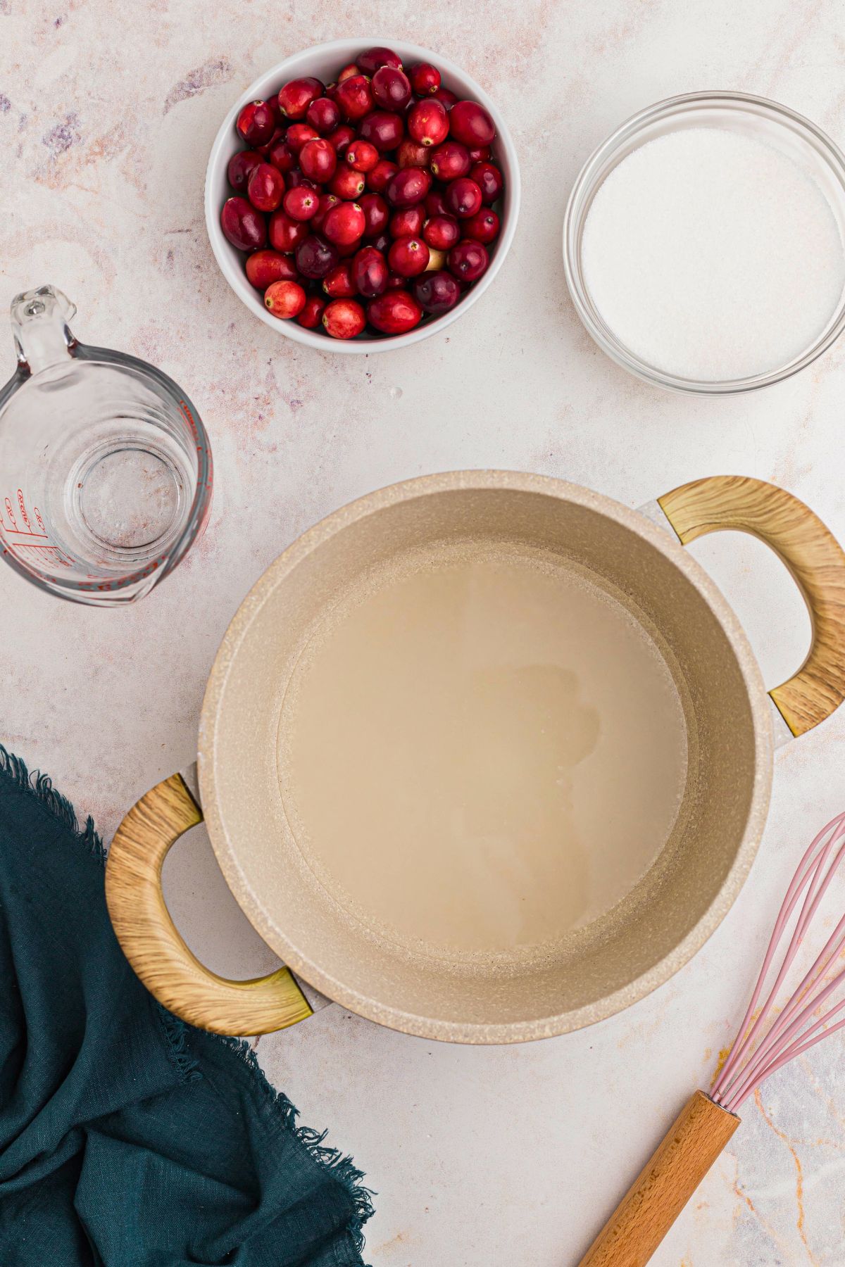 Water in a saucepan with sugar dissolved in the pan. 