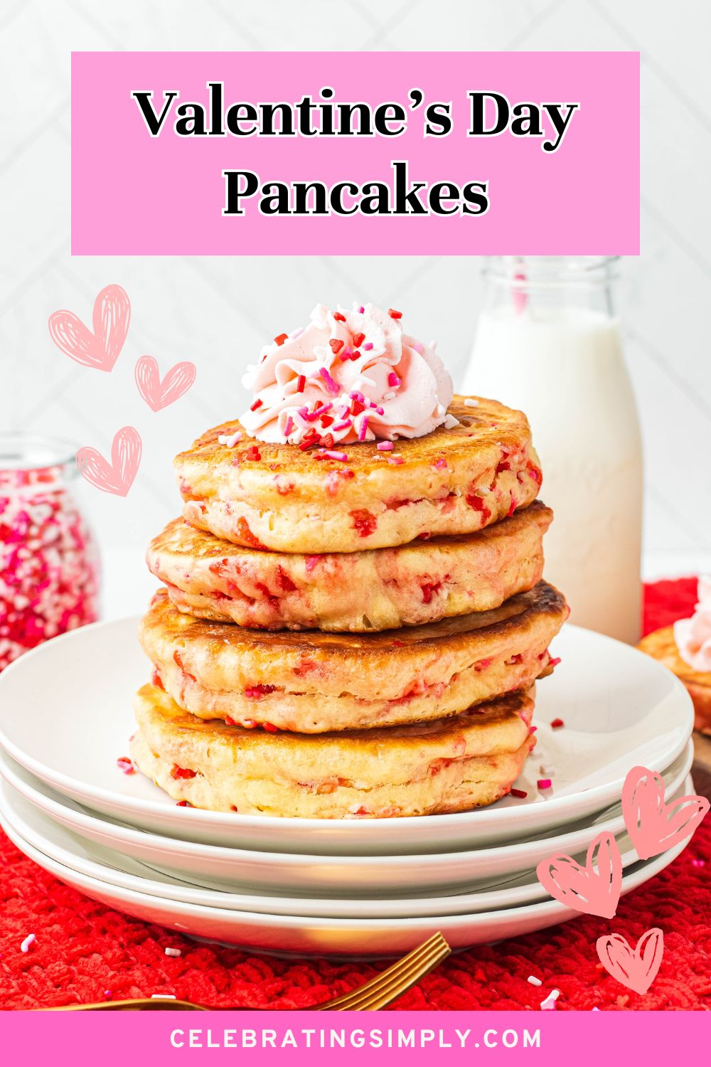 Golden fluffy stacked pancakes on a white plate, filled with Valentine's sprinkles.