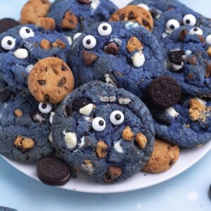 Bright blue cookie monster cookies filled with crushed cookies, chocolate and white chocolate chips.