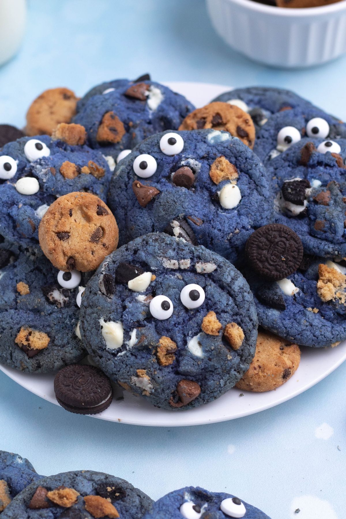 Bright blue cookie monster cookies filled with crushed cookies, chocolate and white chocolate chips.