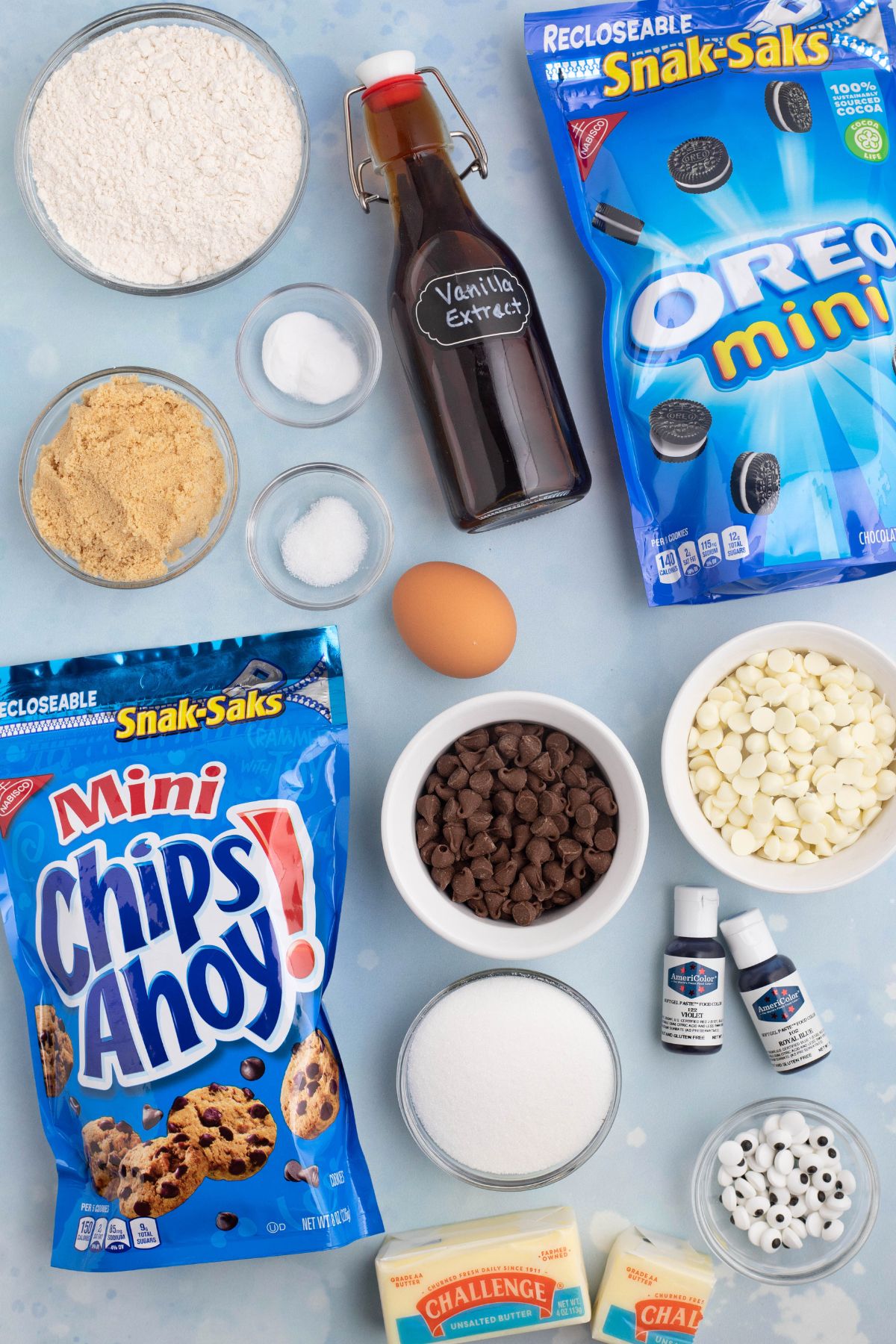 Ingredients needed to make cookie monster cookies measured on a  light blue table. 