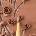 Chocolate spread onto a baking sheet, making chocolate curls.