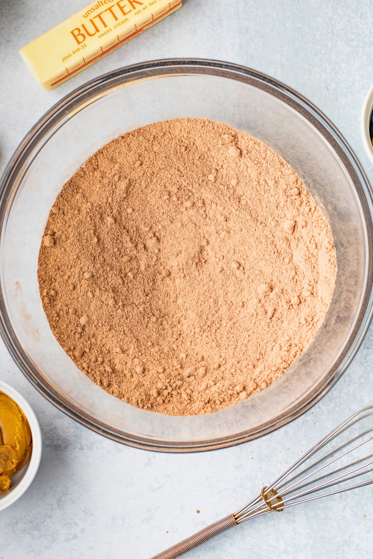 Dry Ingredients being mixed into large mixing bowl. 