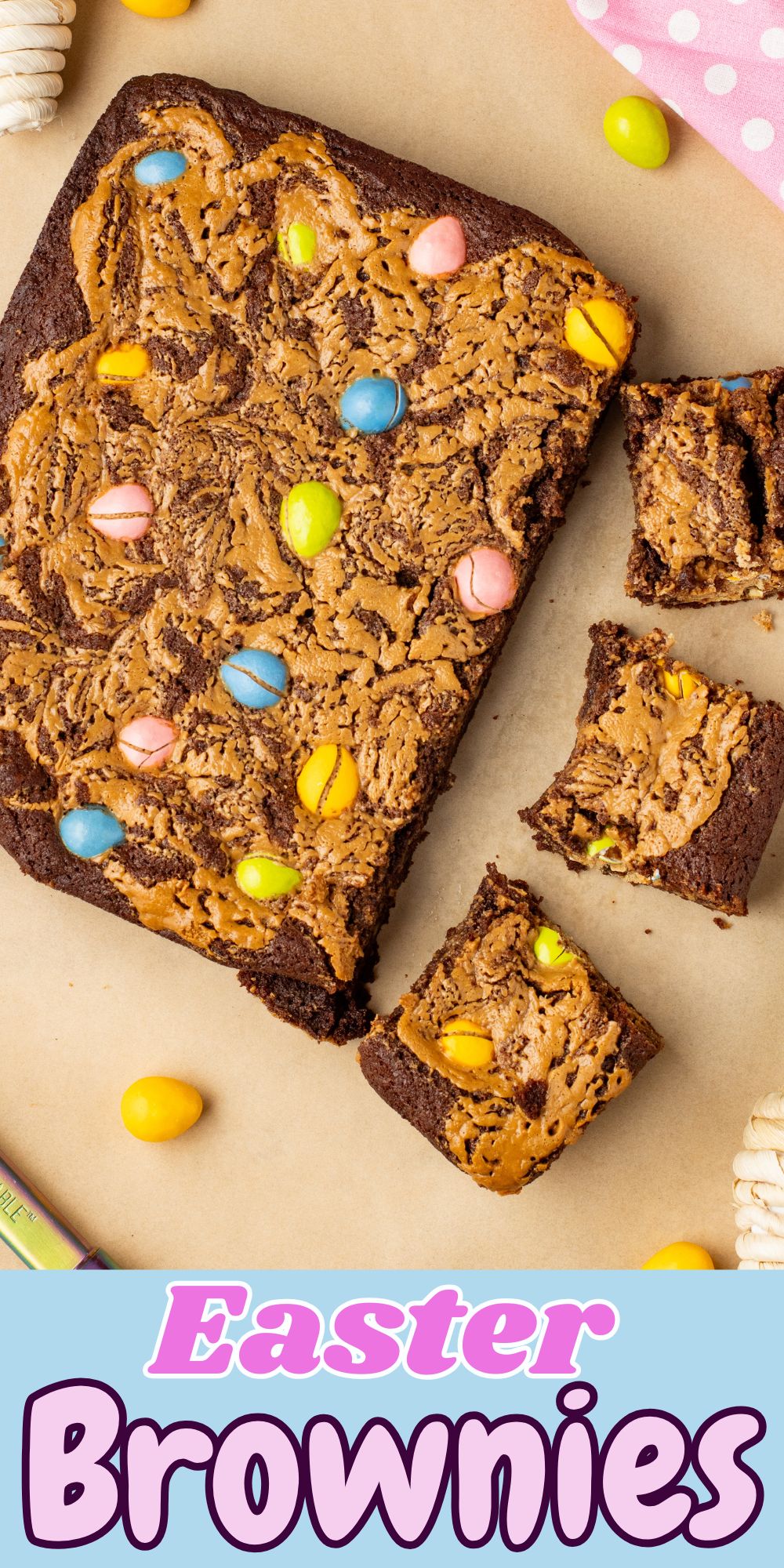 Easter brownies being cut into squares with candies on the table along with a pink linen.