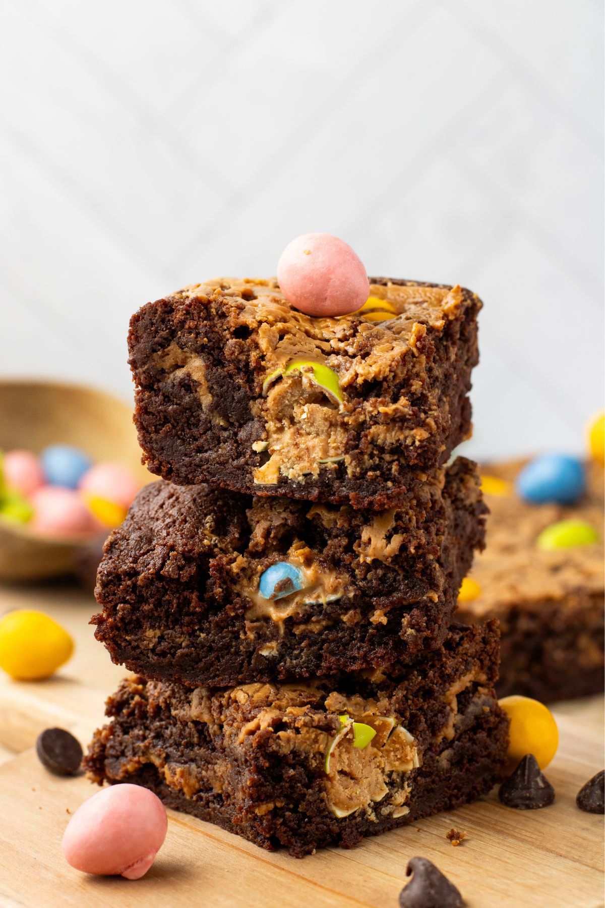 Chocolate and peanut butter Easter brownies stacked on the table after being cut into slices. 