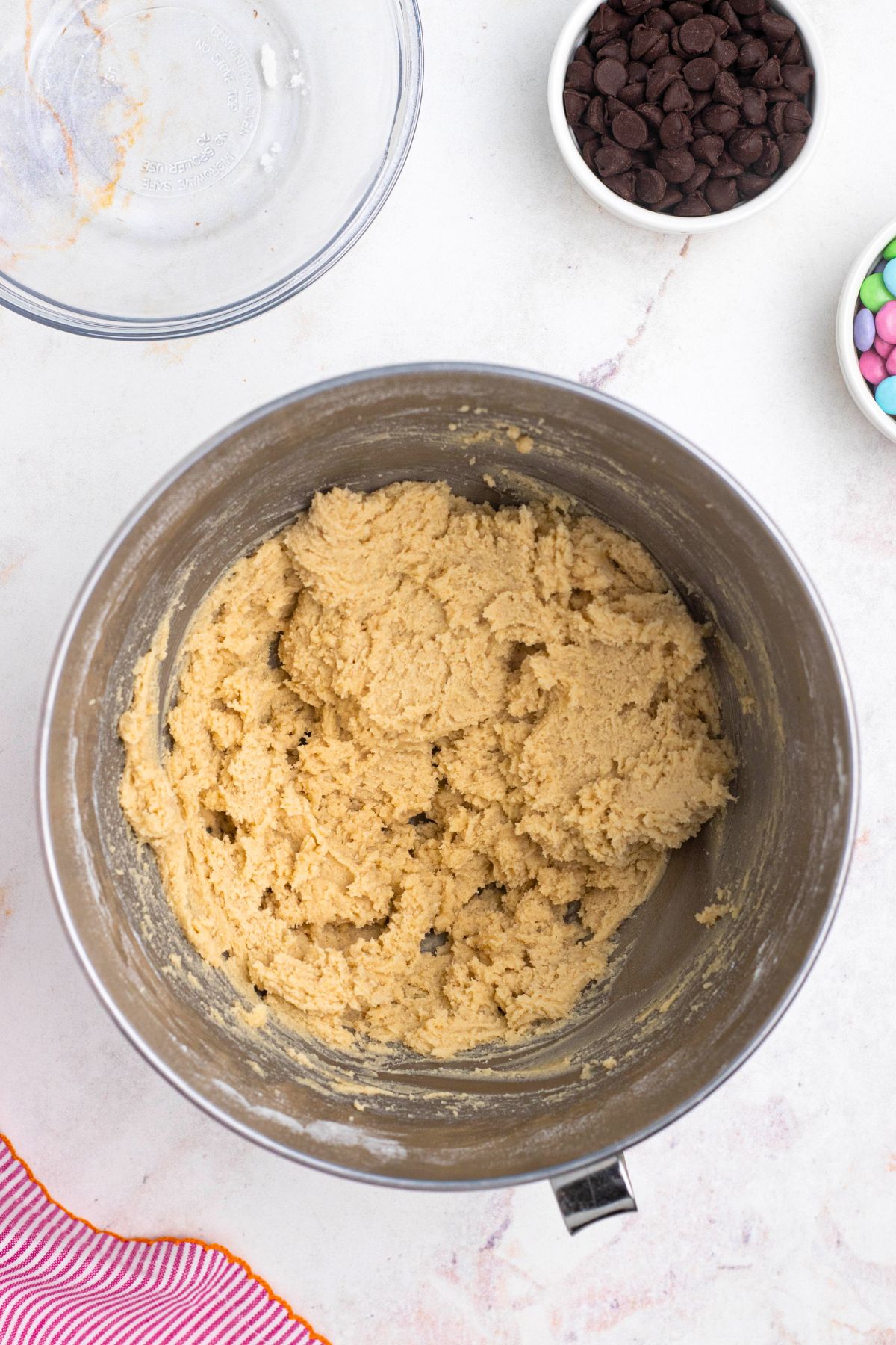 Soft cookie dough mixed in together in a mixing bowl.