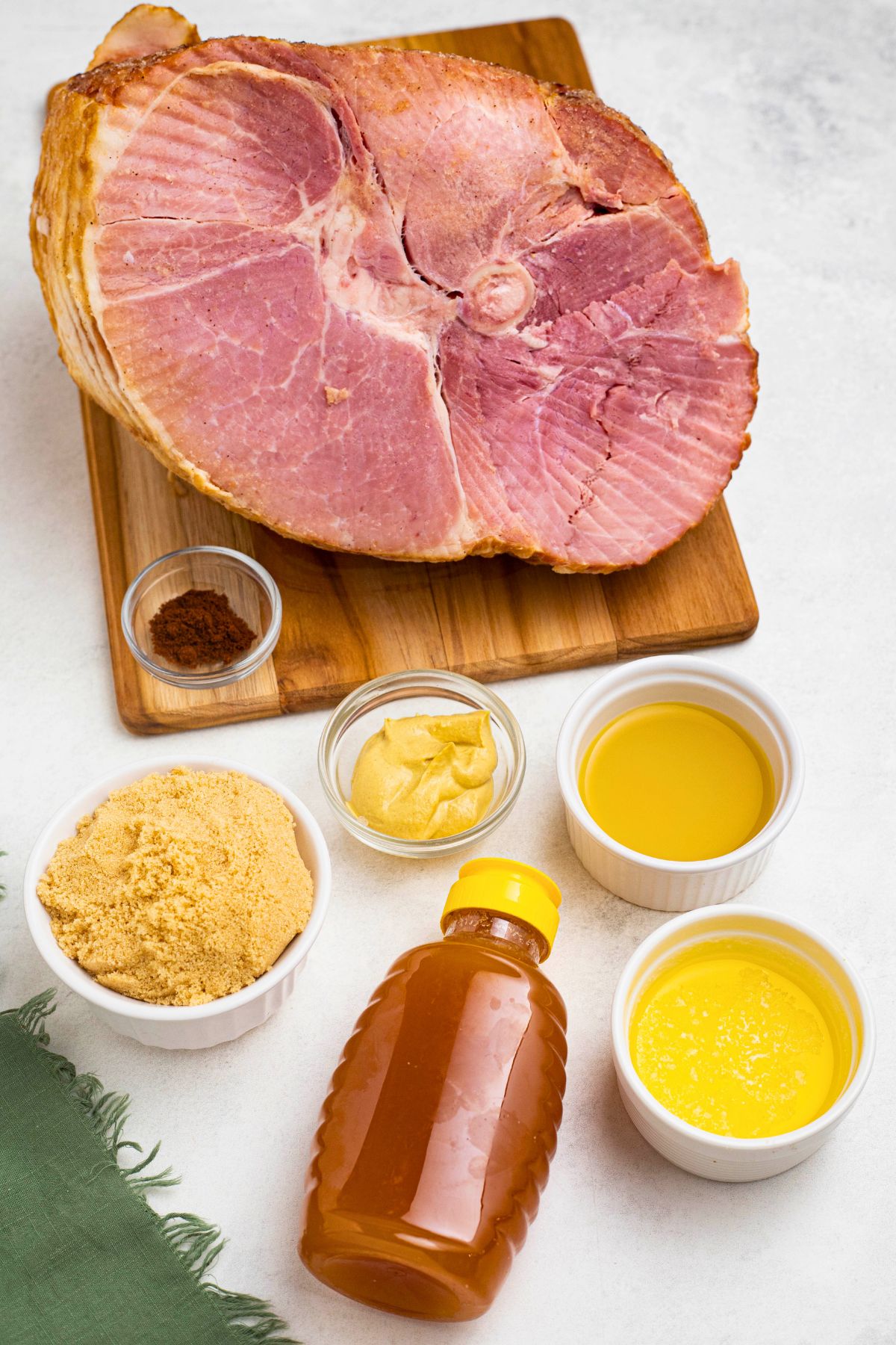 Ingredients for spiral ham on a marble table. 