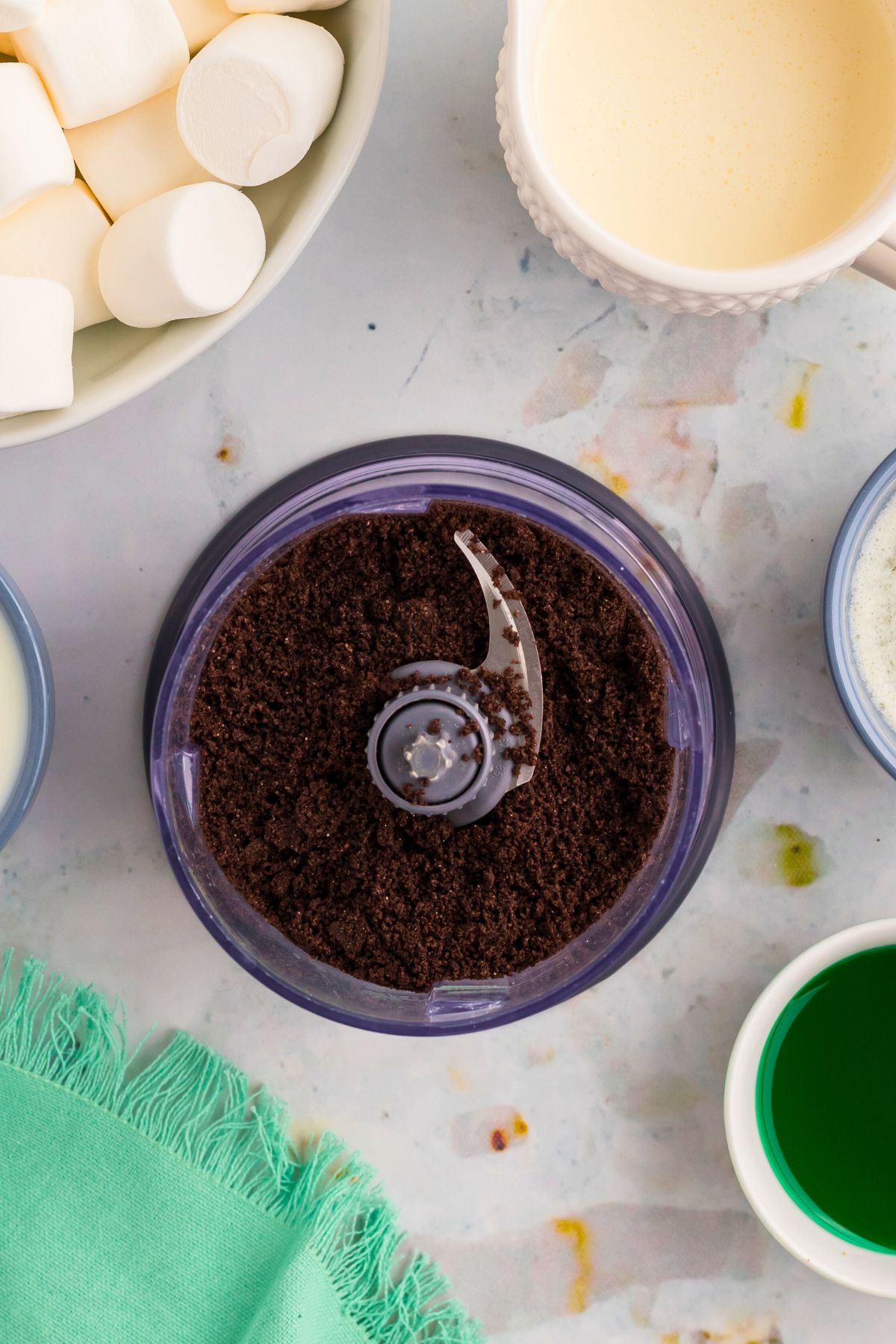 Chocolate cookies crumbled in a food processor before putting in the pie dish. 