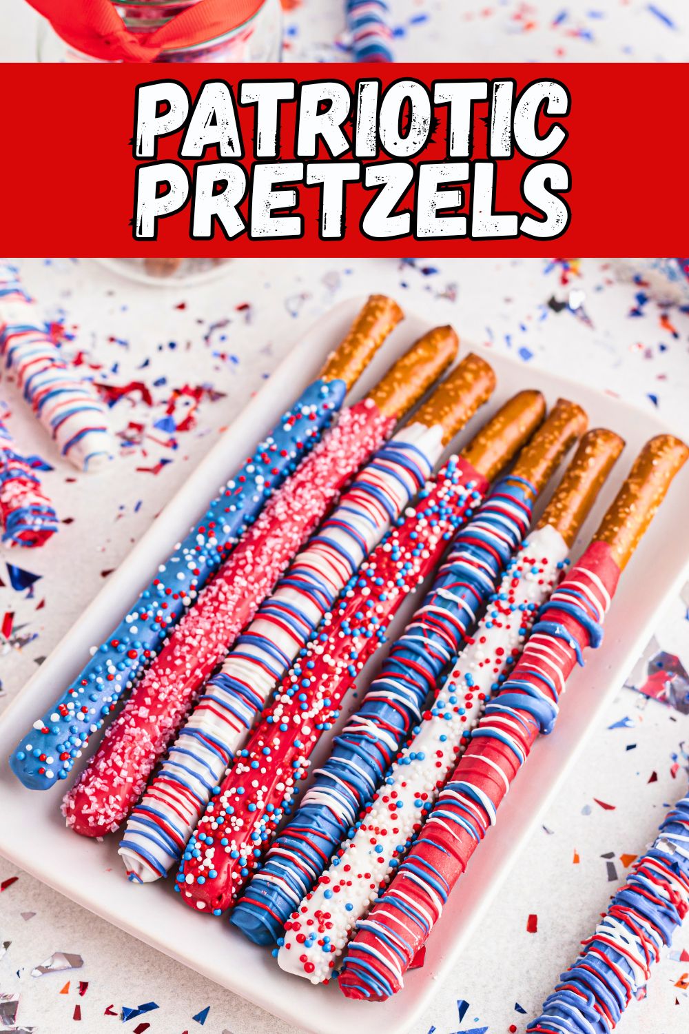 Dipped pretzel rods in red, white, and blue colors with sprinkles.