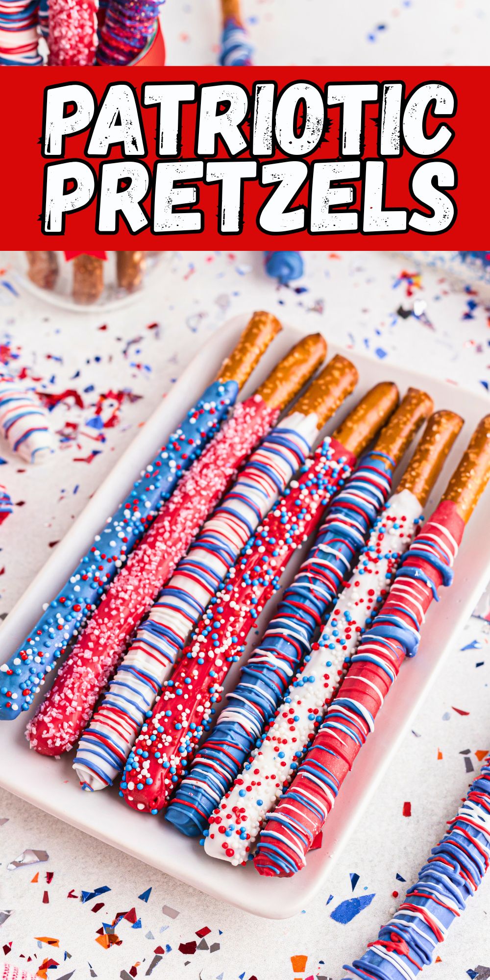 Dipped pretzel rods in red, white, and blue colors with sprinkles.