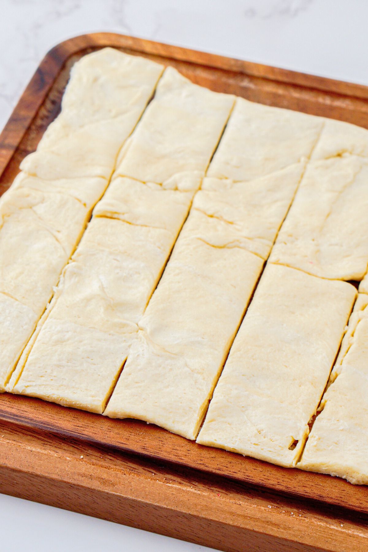 Canned crescent roll dough rolled out and cut into strips. 