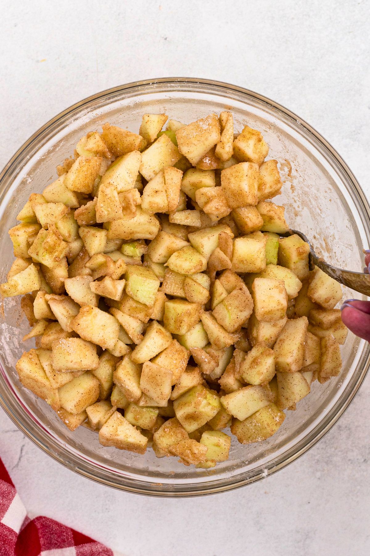 Sliced of apples tossed with flour, sugar, and spices. 