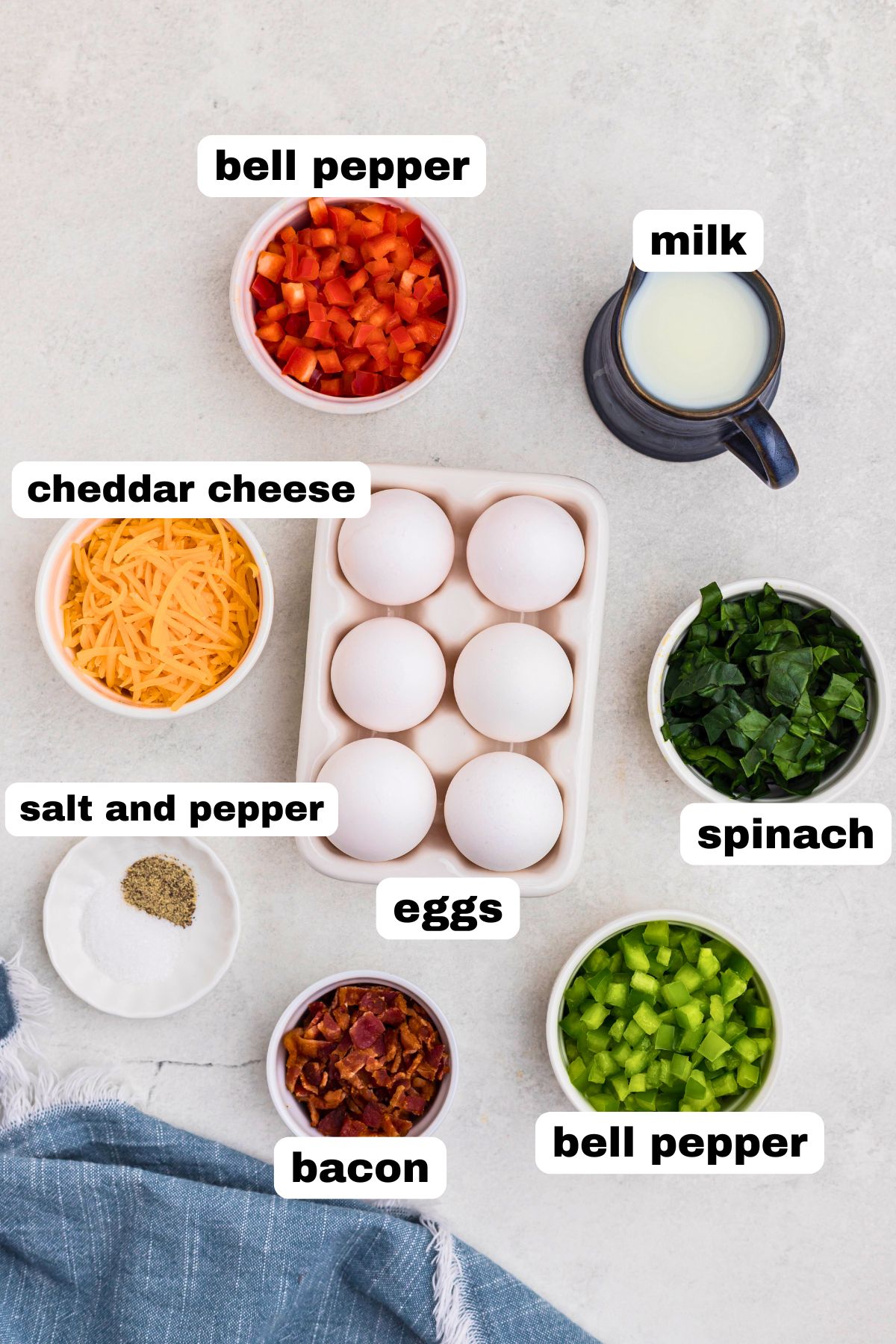 Ingredients measured into small bowls on a marble table. 
