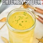Small jar filled with yellow chicken stock.