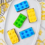 Bright and colorful brownies, frosted and topped with matching candies.