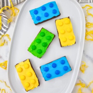 Bright and colorful brownies, frosted and topped with matching candies.