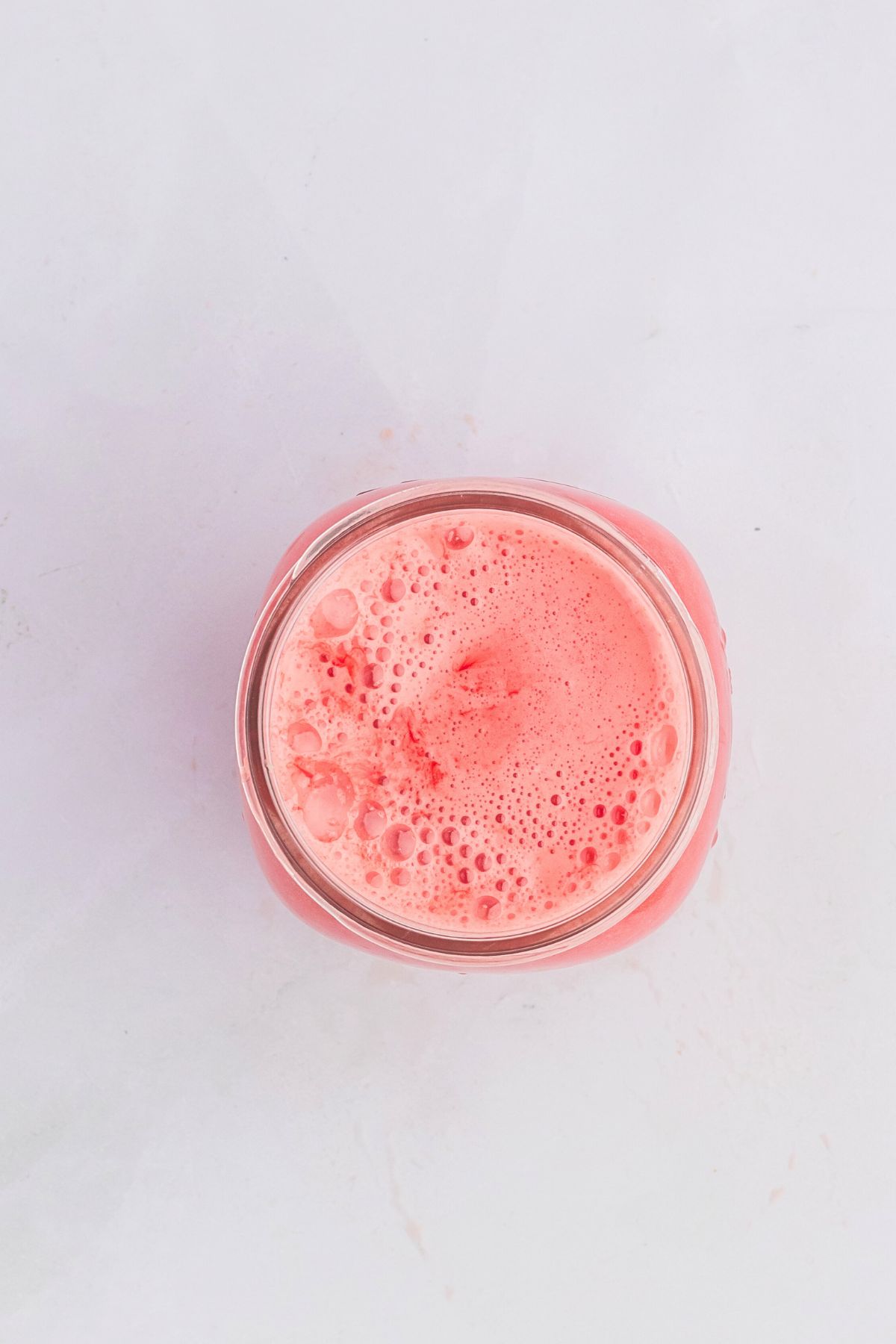 Lemonade mixed and poured into small jar.