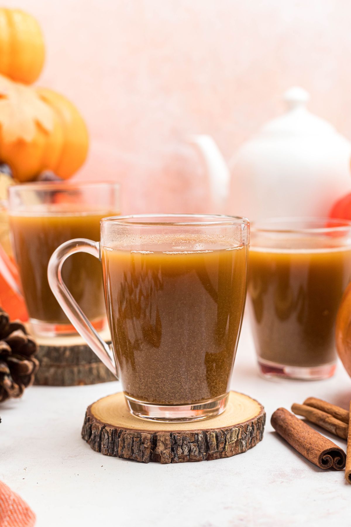 Clear glass of coffee mixed with pumpkin and spice mixture. 