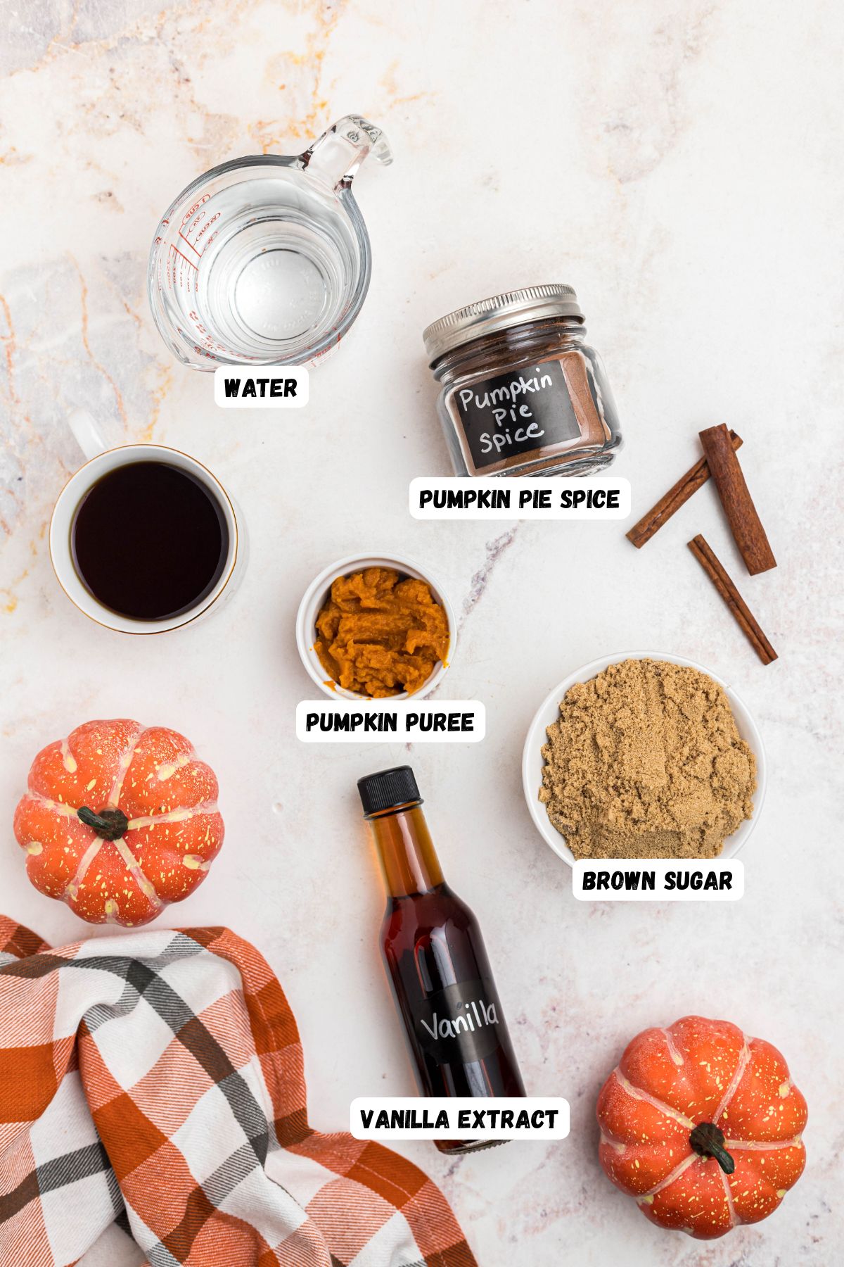 Ingredients measured in small bowl, then labeled , on a marble table. 