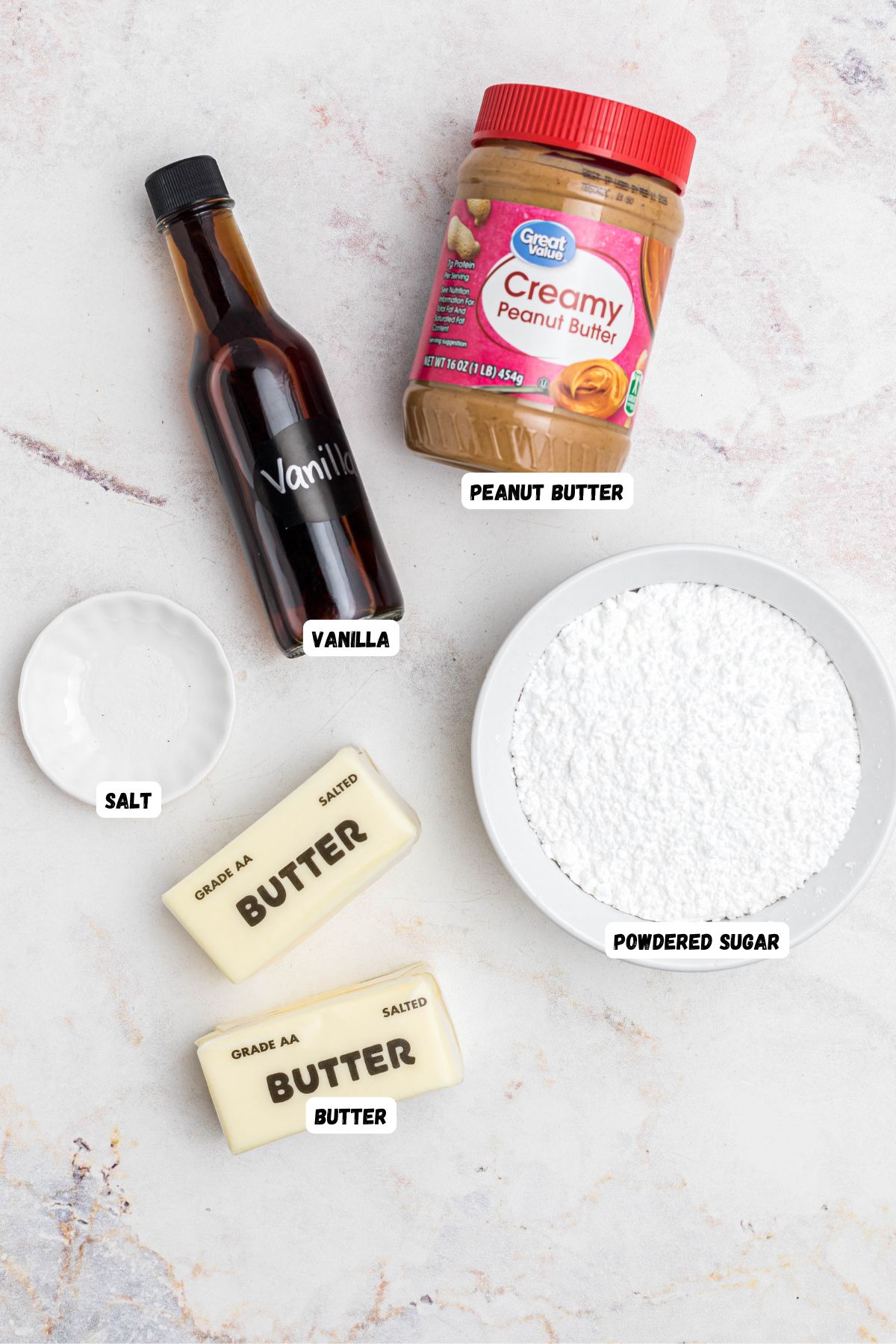 Ingredients measured out in small bowls and in bottles, on marble table, then labeled. 