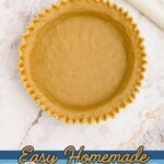 Golden pie crust, rolled into pie plate, with edges fluted.