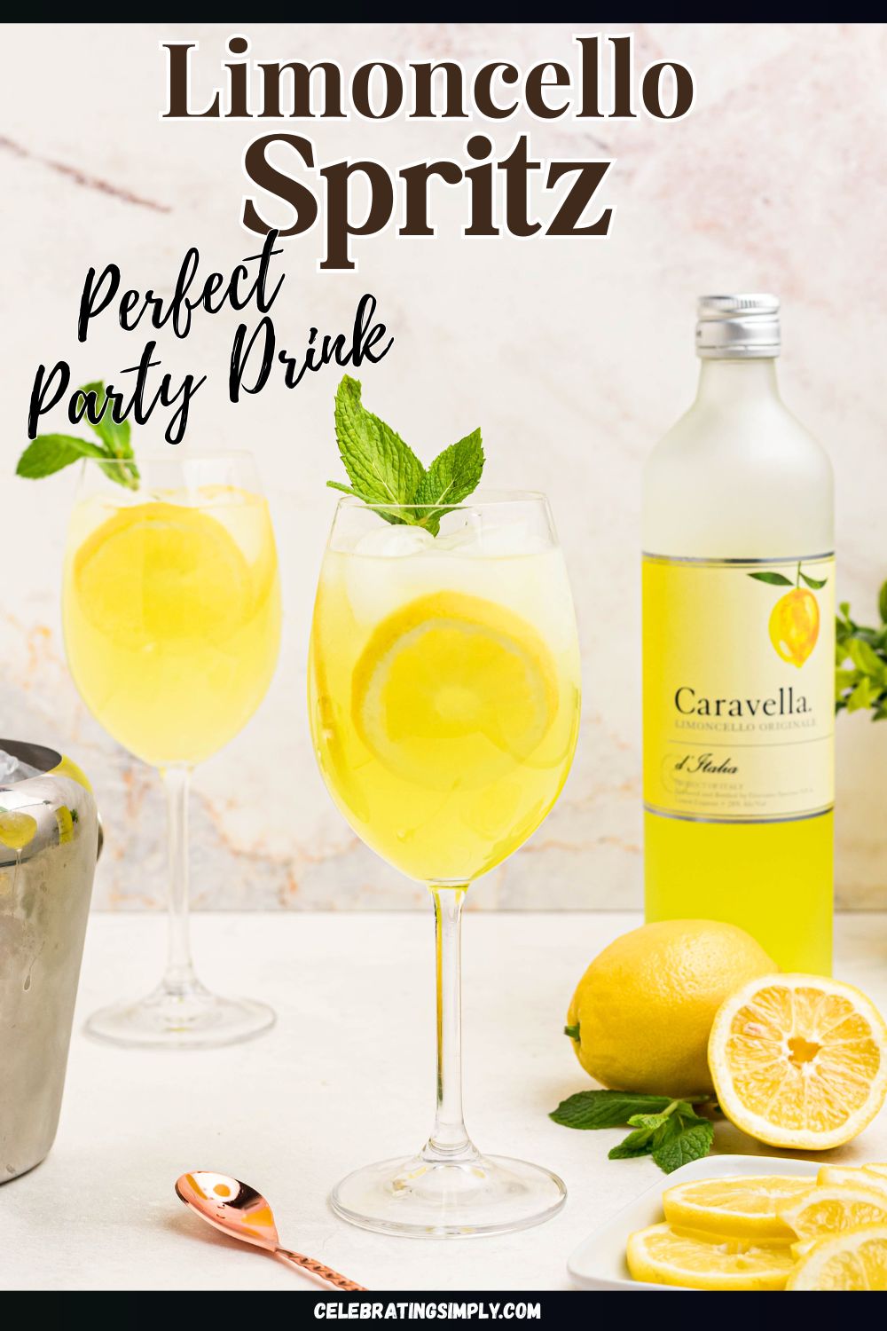 Glass of yellow limoncello spritz, topped with a sprig of mint and a lemon slice garnish.