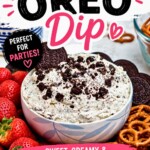 Strawberries, pretzels, and chocolate cookies, on a round white plate, around a cookies and cream Oreo dip, on a marble table.