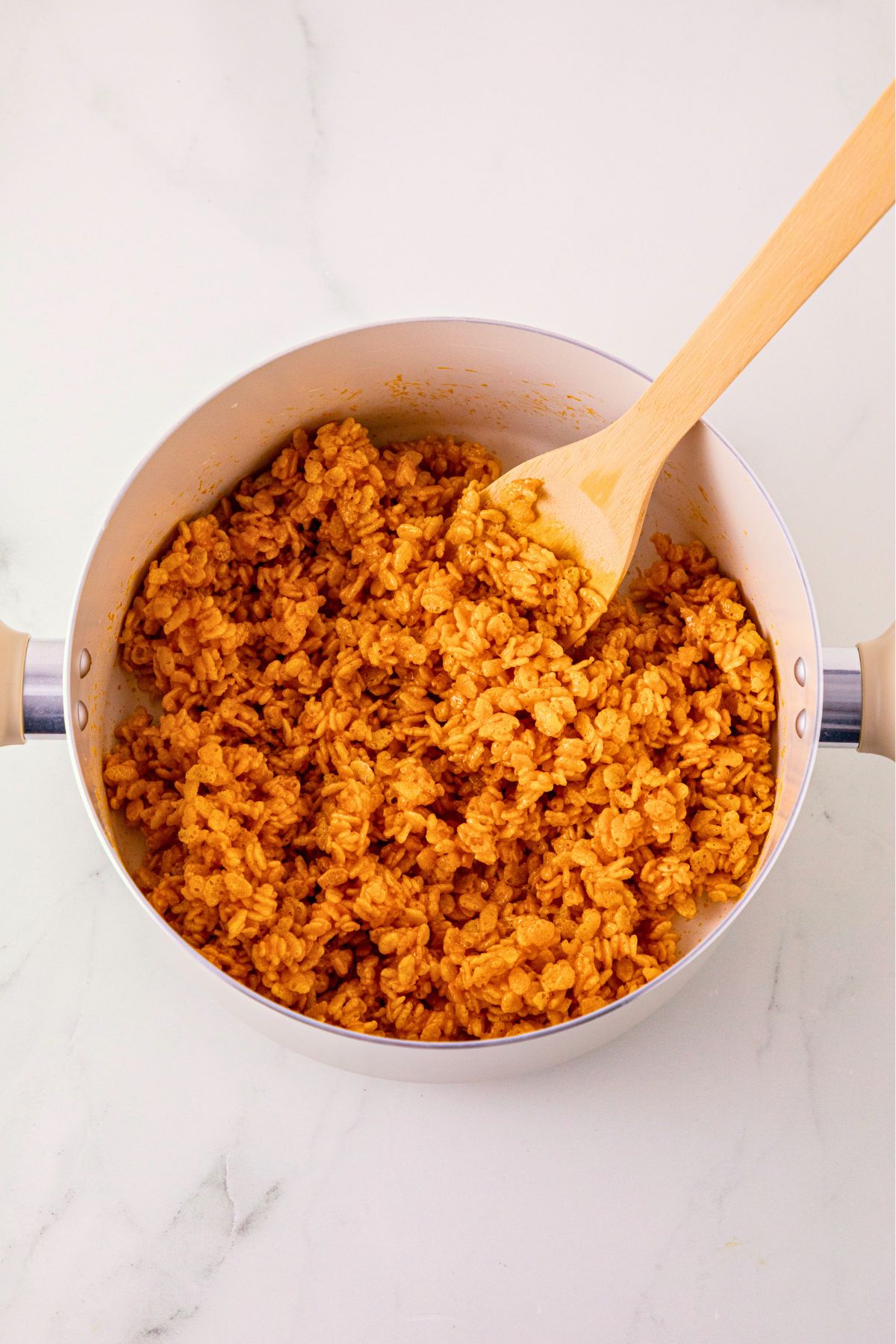 Marshmallows and rice krispies mixed together with pumpkin and butter mixture.
