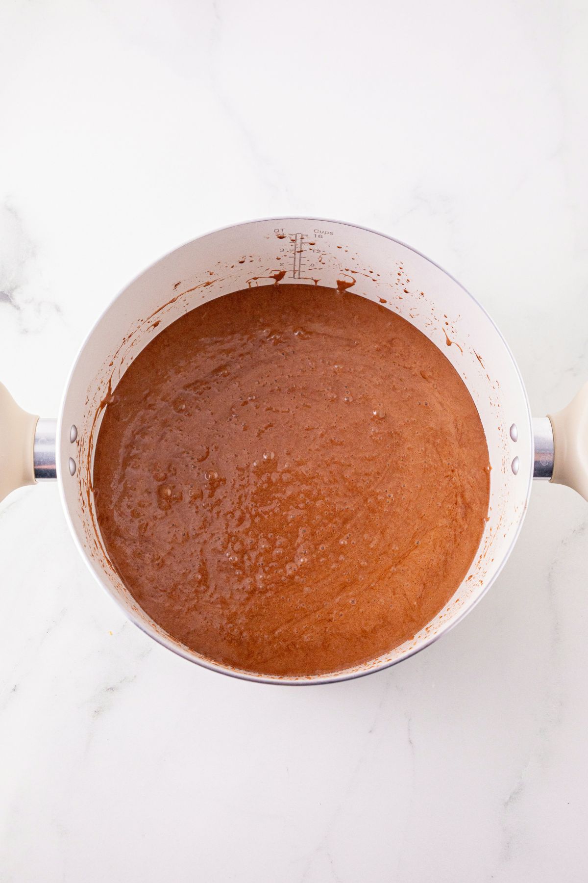 Melted butter, mixed with cocoa powder, to make a light brown mixture. 