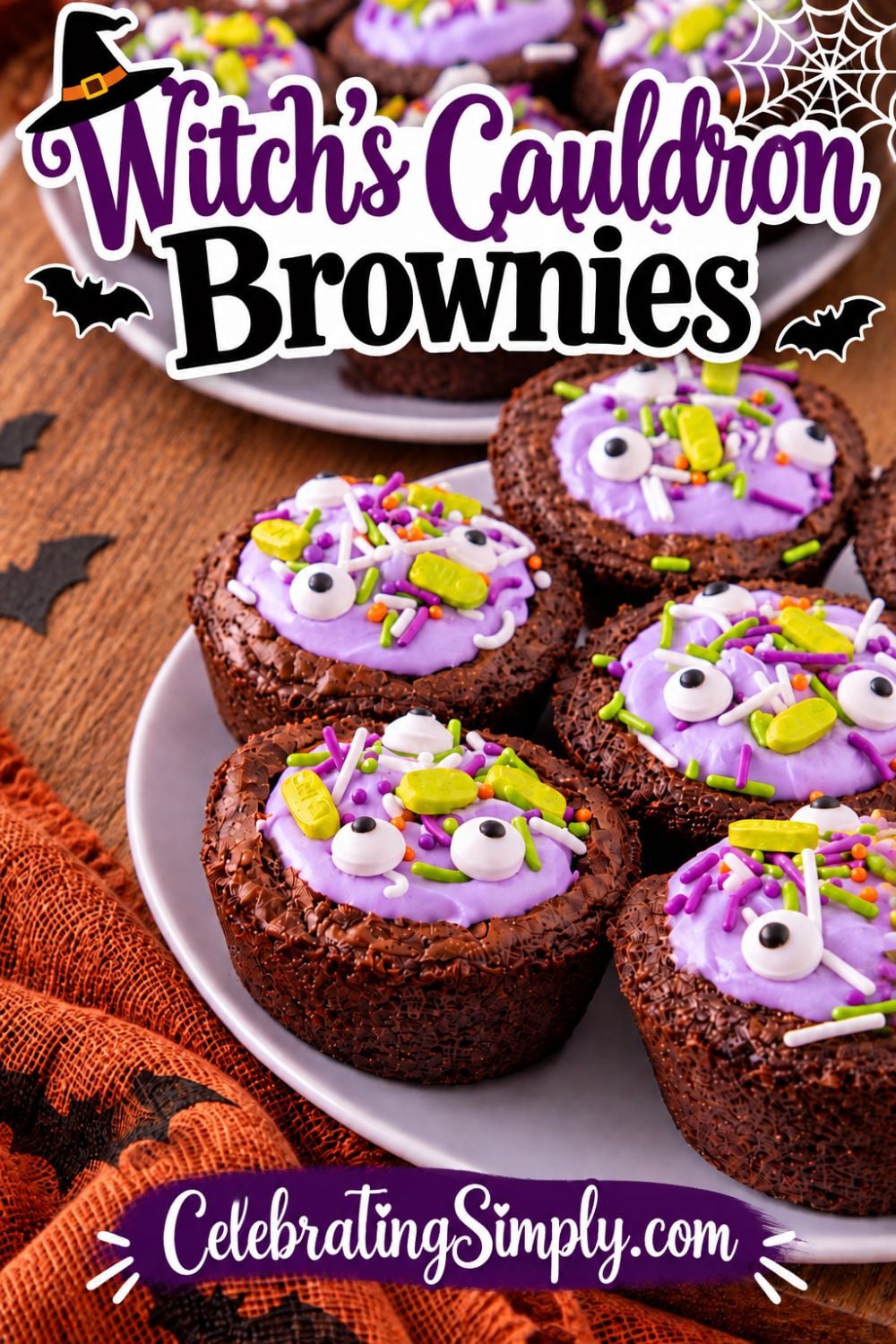 Witch’s Cauldron Brownies filled with purple frosting and topped with colorful Halloween sprinkles and candy eyeballs.